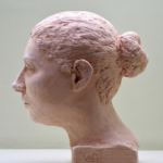 Clay sculpture of a female head