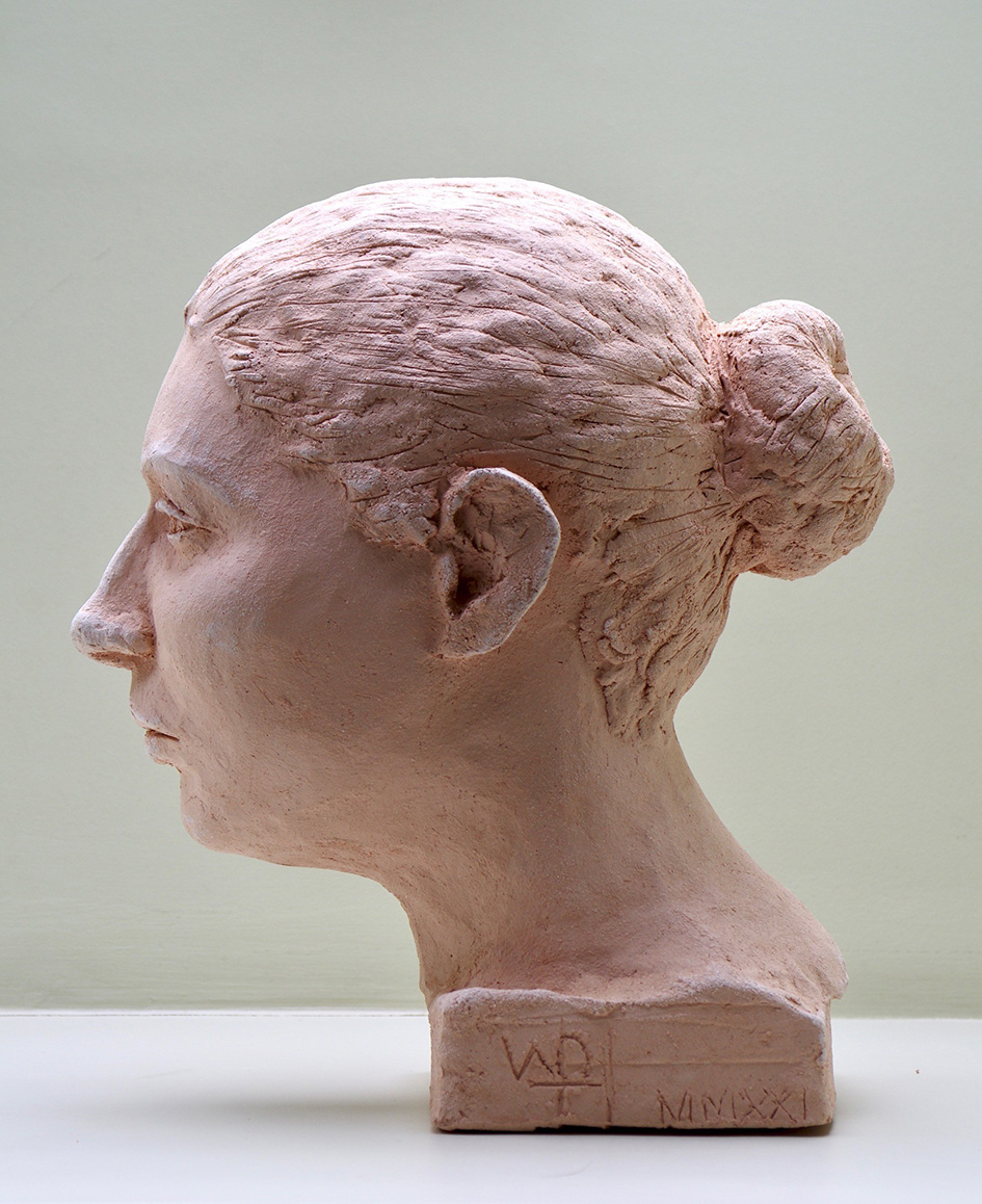 Clay sculpture of a female head